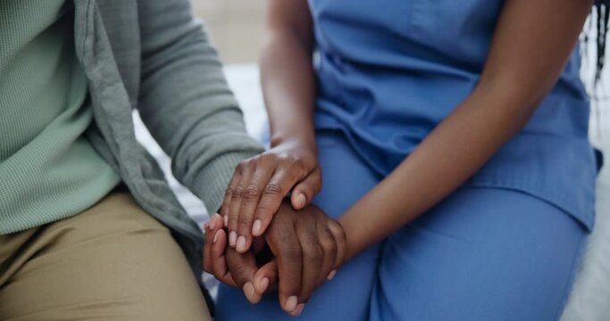 Hands, caregiver and compassion for senior person, kindness and support in consultation at home. Closeup, trust and holding hands for empathy in retirement, nurse and helping with elderly care
