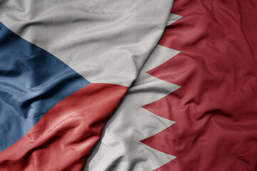 big waving national colorful flag of bahrain and national flag of czech republic.