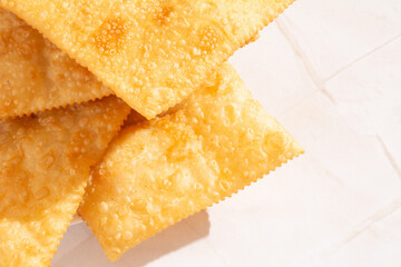 Pastel de Feira crocante brasileira traditional pastry fried street food close up top view