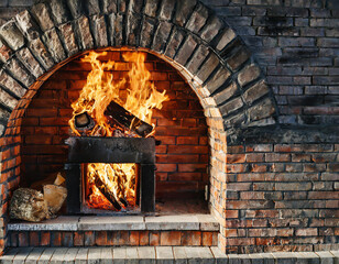 Brick oven with open fire, background with copy space