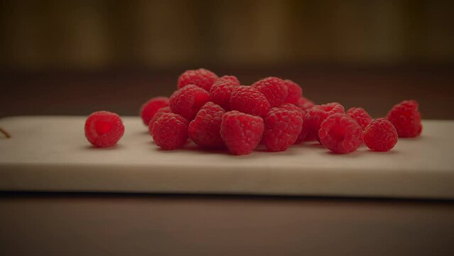 Fresh Organic Red Raspberries Fruits on Wooden Table Background