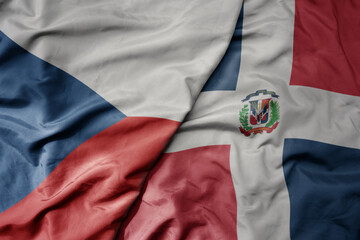 big waving national colorful flag of dominican republic and national flag of czech republic.