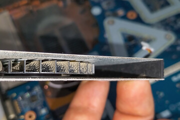 Laptop CPU cooling fan with clogged guide vanes. In the process of work, clogged with dust, leads to noise, overheating and failure or break