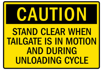 Truck warning sign and labels stand clear when tailgate is in motion and during unloading cycle
