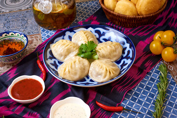 Manti with tea and bread. Oriental background