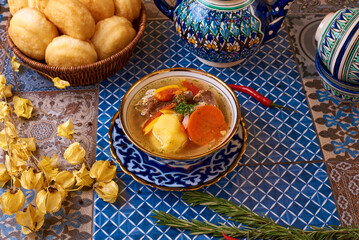 Shurpa soup on an oriental table, background