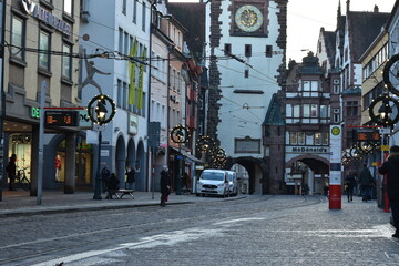 Historic City Gate Tower and Street Decorated with Lights in Freiburg, Germany - 740049181