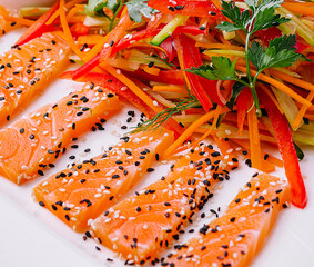 Salmon Slices with Carrot and Pepper Salad and Soy Sauce - Asian Cuisine