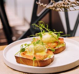 Bread Toast with smashed Avocado, Salmon and Poached Egg