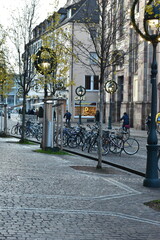  Cobblestone Pavement with Parked Bicycles in Freiburg, Germany - 740054316