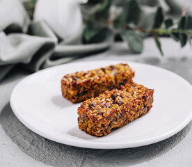 Two granola bar on white plate