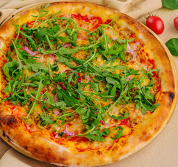 pizza with arugula on top view
