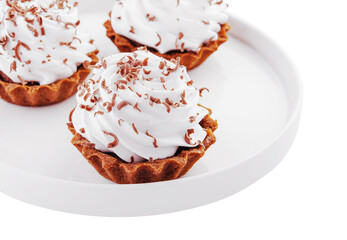 Small chocolate tarts with whipped cream