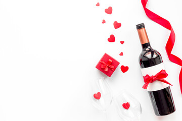 Valentines Day background - wine and red gift box with paper hearts