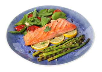 Tasty grilled salmon with tomatoes, asparagus, spinach and lemon isolated on white