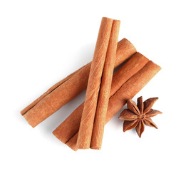Cinnamon sticks and anise star isolated on white, top view