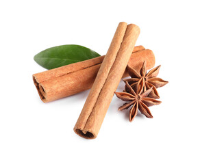 Cinnamon sticks, anise stars and green leaf isolated on white