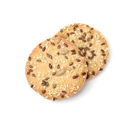 Round cereal crackers with flax, sunflower and sesame seeds isolated on white, top view