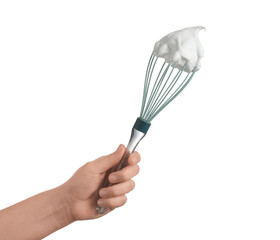 Woman holding whisk with whipped cream on white background, closeup