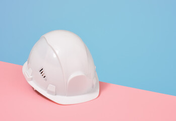 Fototapeta premium White safety helmet. Building construction. Copy space for text.