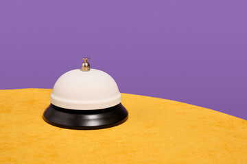 White resonant service bell and copy space for text. Hotel or restaurant.