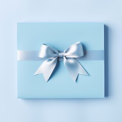 Blank blue piece of paper with gift silk ribbon bow