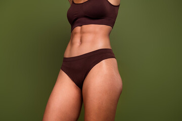Cropped no retouch photo of sexual beautiful woman with strong mascular athletic body abs isolated...