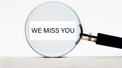 we miss you text written through a magnifying glass
