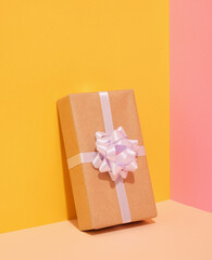 A gift with a bow for a surprise birthday party. Celebration concept.
