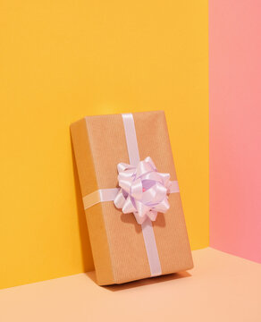 A gift with a bow for a surprise birthday party. Celebration concept.