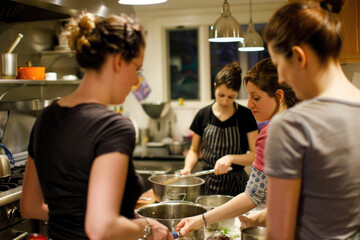 Warm snapshots of camaraderie in the kitchen, evoking the pleasure of shared culinary adventures