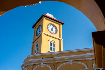 Iconic yellow clock tower in Chino-Portuguese style in Phuket old town