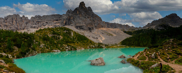Turquoise Sorapis Lake in Cortina d'Ampezzo, with Dolomite Mountains and Forest - Sorapis Circuit, Dolomites, Italy, Europe - obrazy, fototapety, plakaty