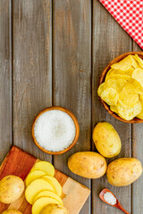 Cooking homemade potato chips - oven backed raw potatoes with salt