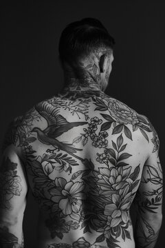 back of gangster full of tattoos