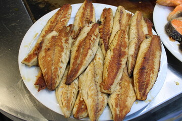 fried fish on the counter. fresh and delicious salmon