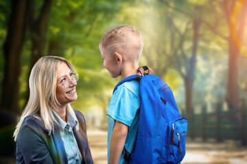 Parent escorts happy child to school