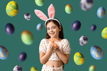 Cute little girl with bunny ears and toy rabbit on green background. Easter celebration