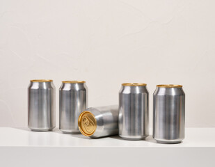 Metal aluminum beverage drink cans on table. Mirror reflection.