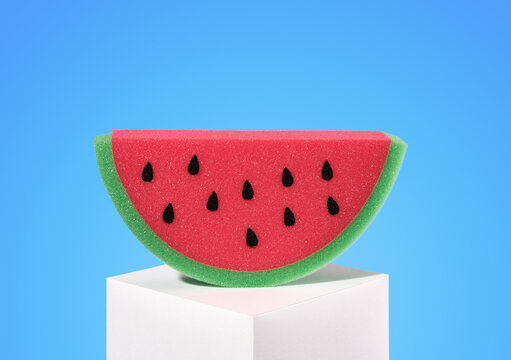 Ripe red watermelon shower sponge. Skin care and treatment.