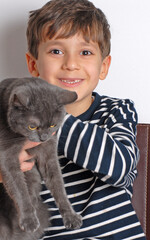Kid holding kitten cat portrait. - 740125158