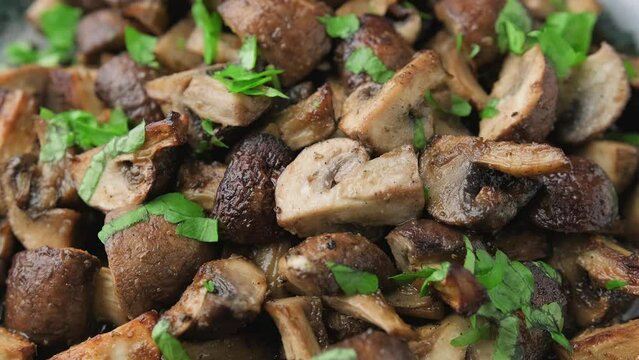 Delicious fried mushrooms with herbs and parsley. Rotating video