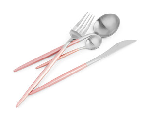 Stainless steel set of cutlery with pink handles on white background