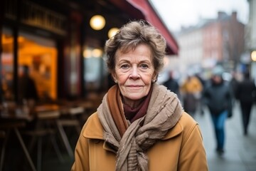 Fototapeta premium Portrait of a senior woman on a street in Paris, France