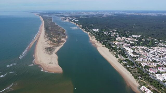 Aerial view of the Rompido Arrow (La Flecha del Rompido), a sand bank formed on the Rompido and Portil beaches that already reaches La Bota beach,with el Portil white village in the right side