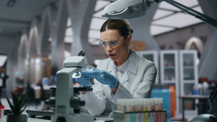 Laboratory scientist looking drugs samples in modern innovation clinic close up.