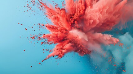 An explosion of red colored dust on a blue background