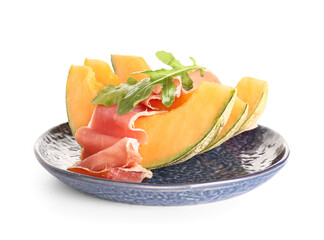 Plate of delicious melon with prosciutto and arugula on white background