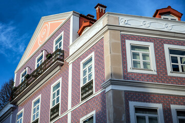 Historic building covered in red and blue azulejos in Lisbon, Portugal