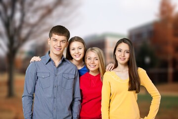 Group of happy young students at campus together